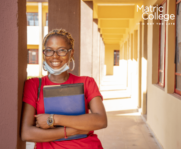 Thoughtful young woman holding books, wondering: do I need a Matric certificate to study?